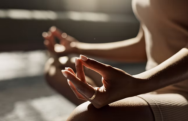 Woman Meditating Indoors